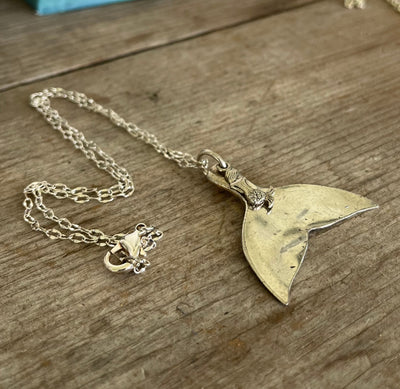 Silverware jewelry spoon necklace in the shape of a mermaid's tail with mermaid charm