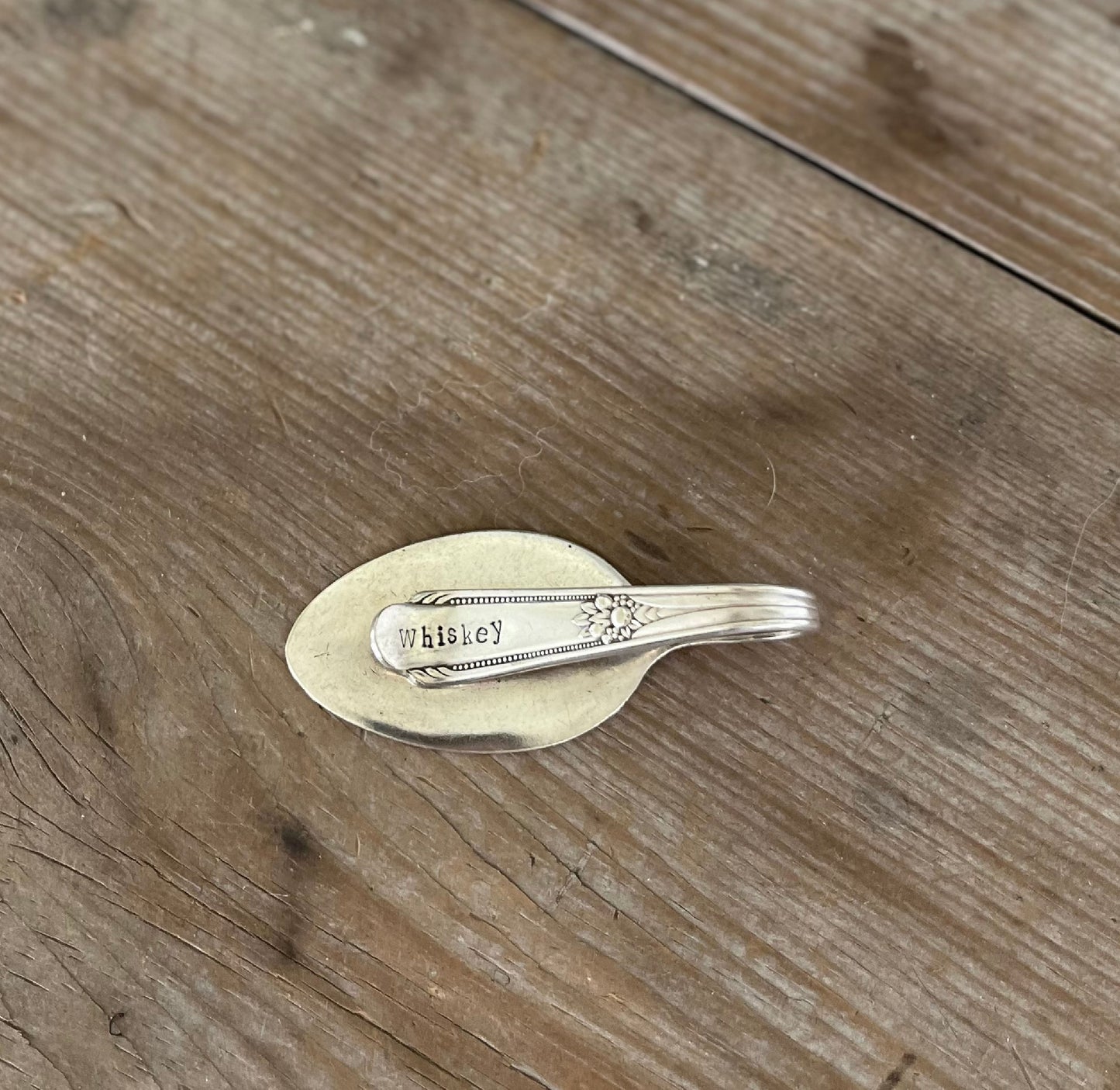 Vintage silverplate spoon money clip stamped WHISKEY - front view with patina
