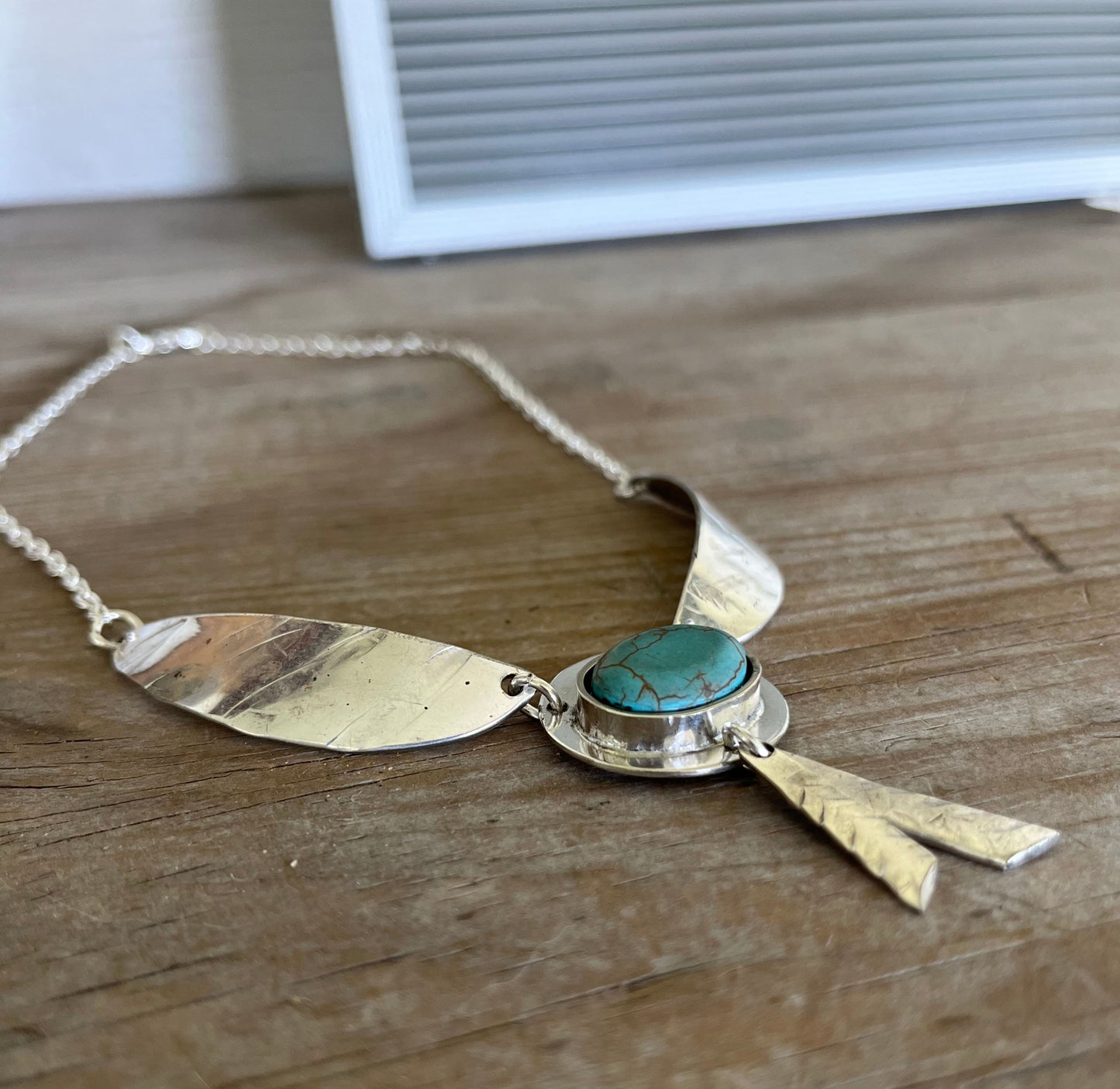 Side view of Artisan Native Wings statement necklace - one-of-a-kind upcycled silverware gift
