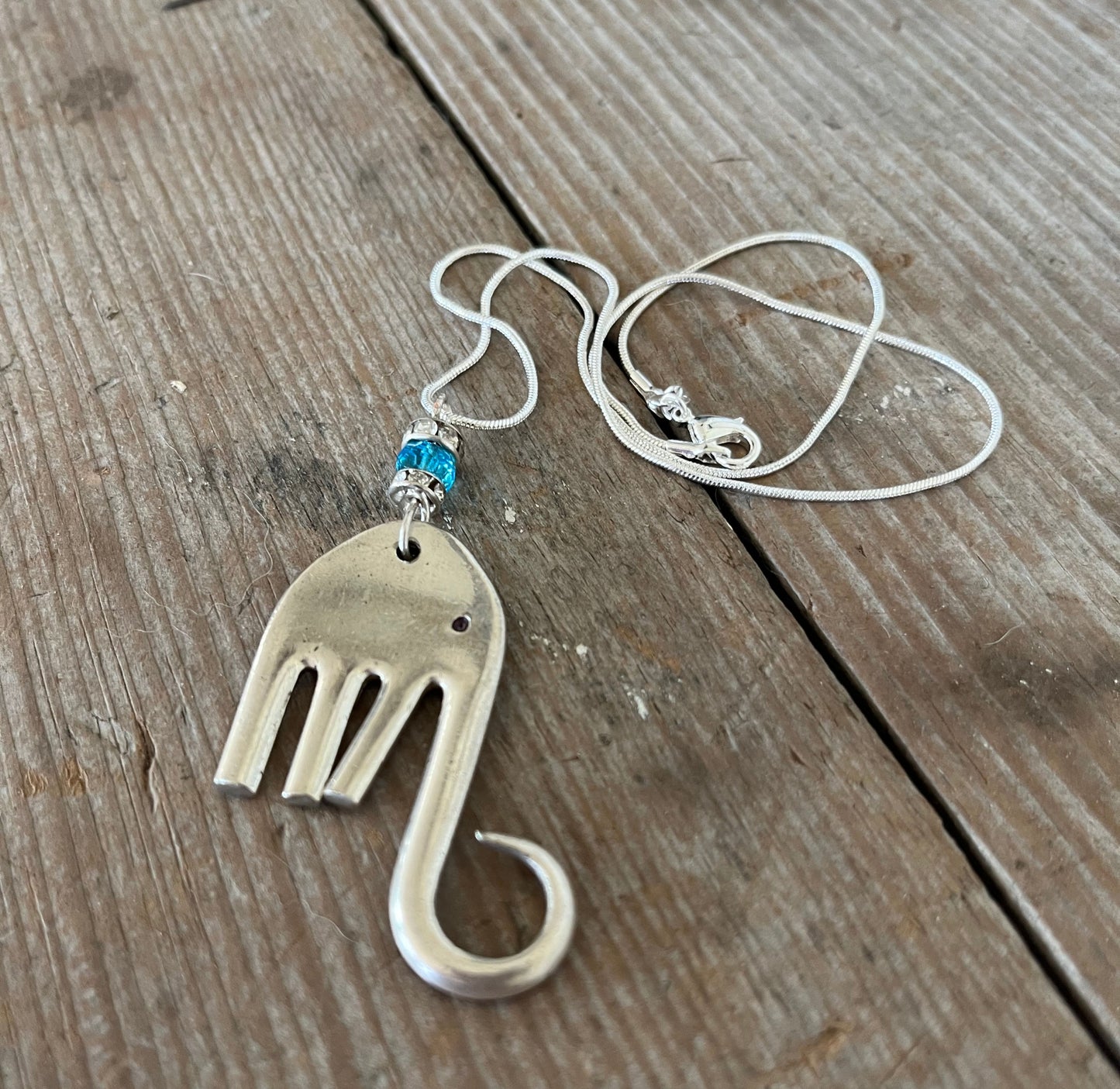 Complete fork elephant necklace Lucy on 23-inch silverplate chain with rhinestone and aquamarine bead embellishments