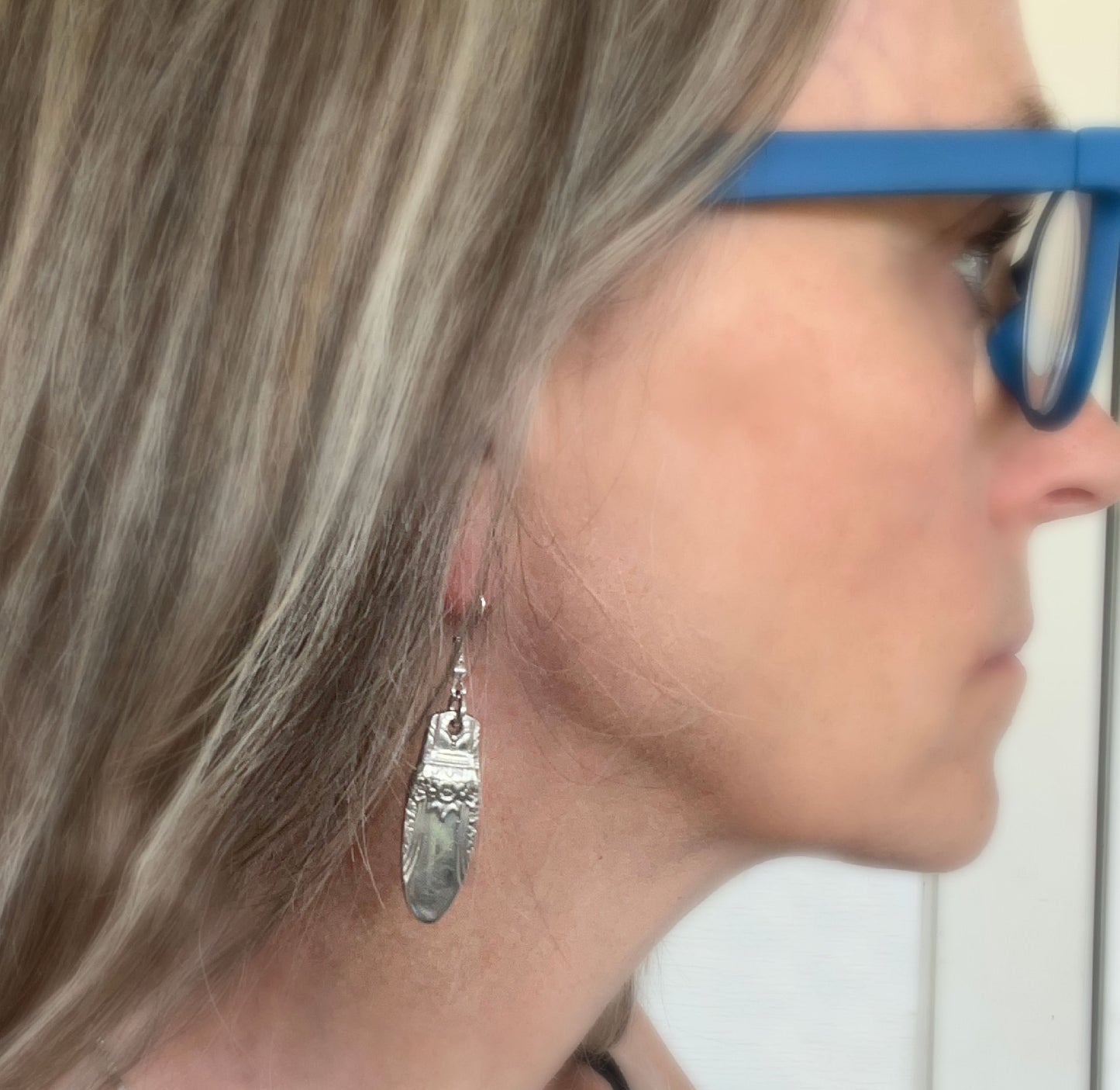 FIRST LOVE pattern spoon handle drop earrings shown on model - spoon earrings - handcrafted from upcycled vintage silverware - Laughing Frog Studio