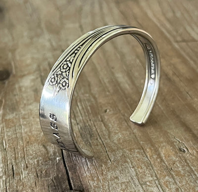 Top view detail of Devonshire/Mary Lou BADASS hand-stamped spoon cuff bracelet - upcycled vintage silverware - Laughing Frog Studio
