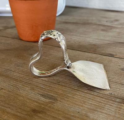 Ballad/Country Lane pattern ergonomic spoon cheese knife showing heart handle from vintage Oneida silverware