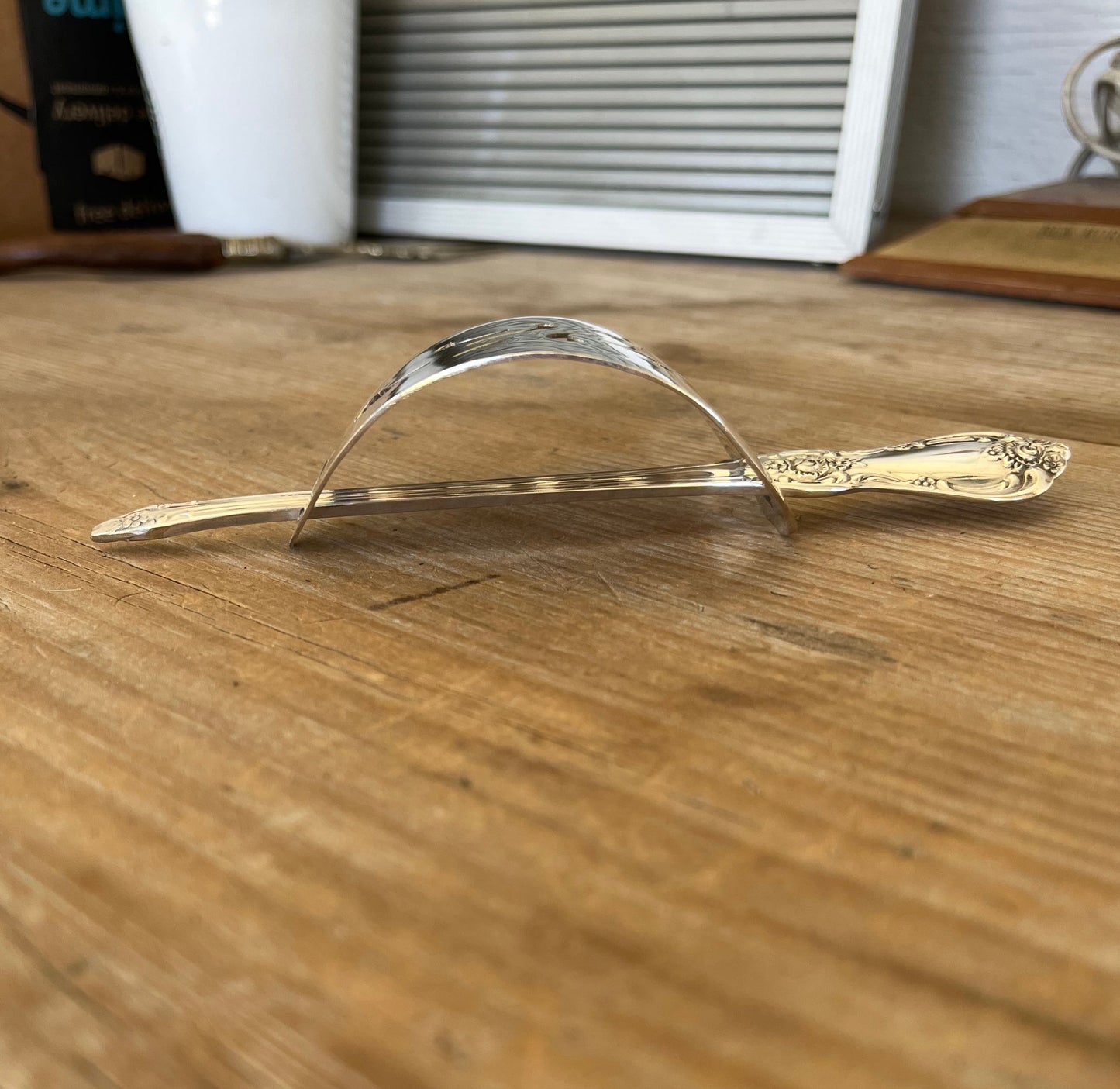 Side view of Oneida Vanessa/Francesca cake server hair barrette with stick - handcrafted from upcycled vintage silverware - Laughing Frog Studio