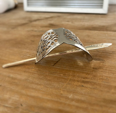 Side view of handcrafted danish cake server barrette w/ Quess Bess silverware stick - upcycled vintage silverware - Laughing Frog Studio