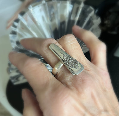 Artisan spoon ring featuring Mountain Rose floral pattern from antique silverware, size 9 shown on a hand