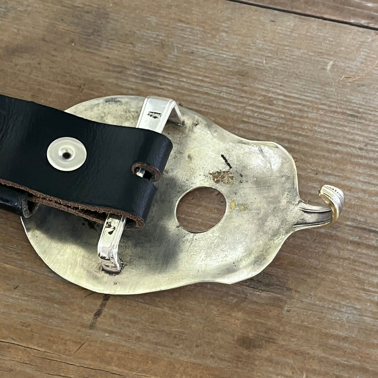 Lucille guitar spoon belt buckle, detail of sound hole, show on a snap belt - handcrafted from upcycled vintage silverware - Laughing Frog Studio