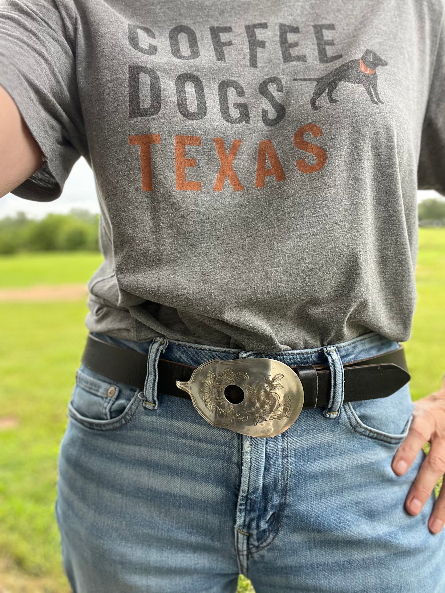 Guitar spoon belt buckle worn on model's belt - handcrafted from upcycled 1913 Wm. Rogers & Son Fair Oak silverplate - Laughing Frog Studio