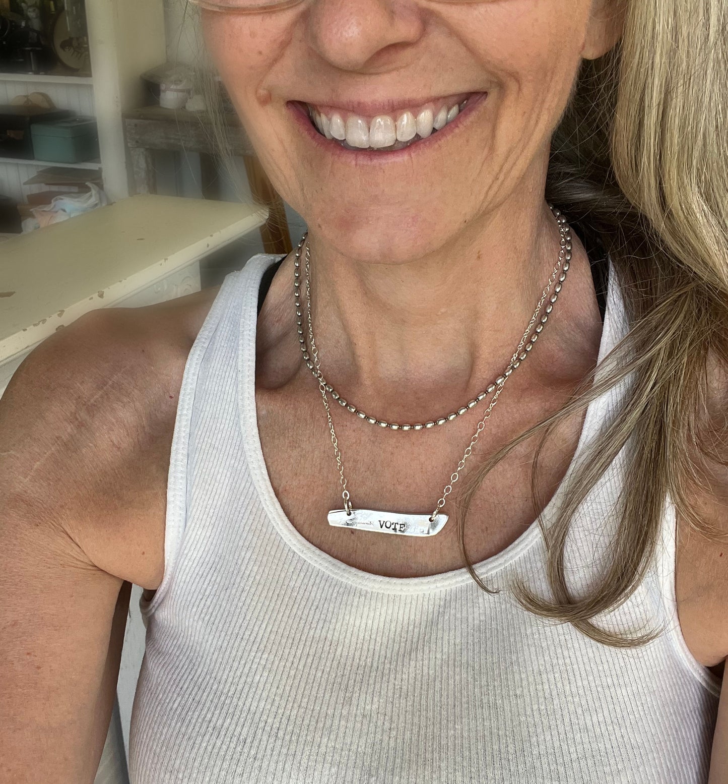 VOTE COMMUNITY bar pendant necklace worn on model - hand-stamped upcycled vintage silverware jewelry - Laughing Frog Studio