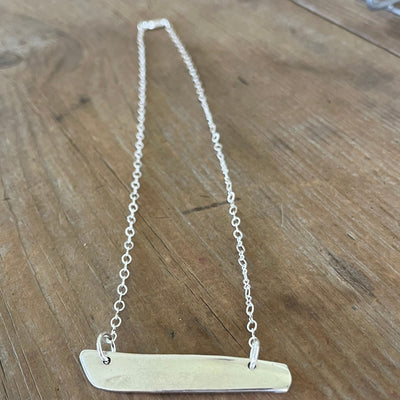 Back view of VOTE COMMUNITY bar pendant necklace showing Community Silverplate maker's mark - upcycled eco-friendly silverware jewelry - Laughing Frog Studio