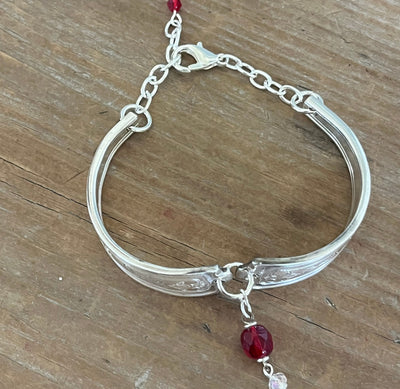 Louvain spoon link bracelet full view with adjustable silver chain clasp and red bead charm - handcrafted from upcycled vintage silverware - Laughing Frog Studio