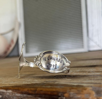 Close-up of mermaid tail fin and hand-stamped detail - Mermaid Soul Precious Mirror pattern spoon cuff bracelet - handcrafted from upcycled vintage silverware - Laughing Frog Studio