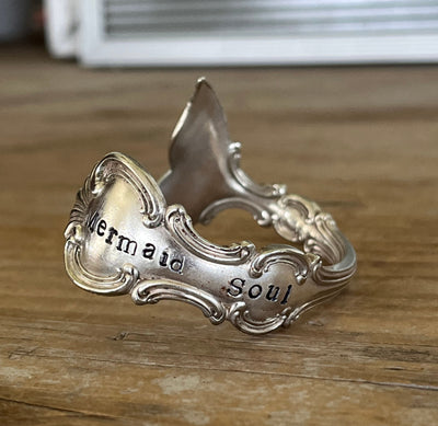 Close-up of mermaid tail fin and hand-stamped detail - Mermaid Soul Troy pattern spoon cuff bracelet - handcrafted from upcycled vintage silverware - Laughing Frog Studio