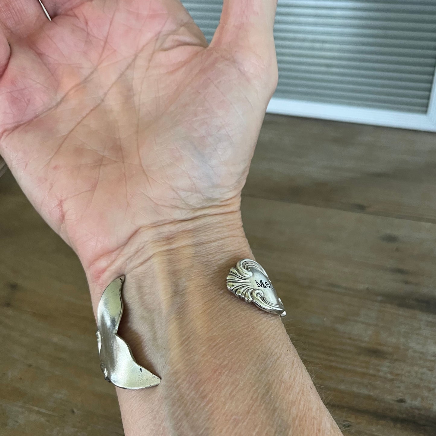 Worn on wrist underside view - Mermaid Soul Troy pattern spoon cuff bracelet - handcrafted from upcycled vintage silverware - Laughing Frog Studio
