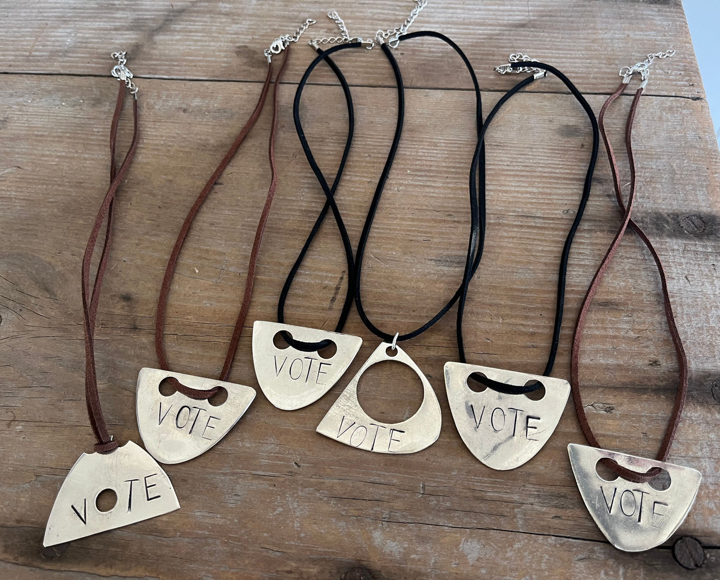 VOTE hand-stamped vintage spoon necklace shown with other Laughing Frog Studio hand-stamped silverware necklace designs - upcycled silverware jewelry collection - handcrafted from upcycled vintage silverware - Laughing Frog Studio