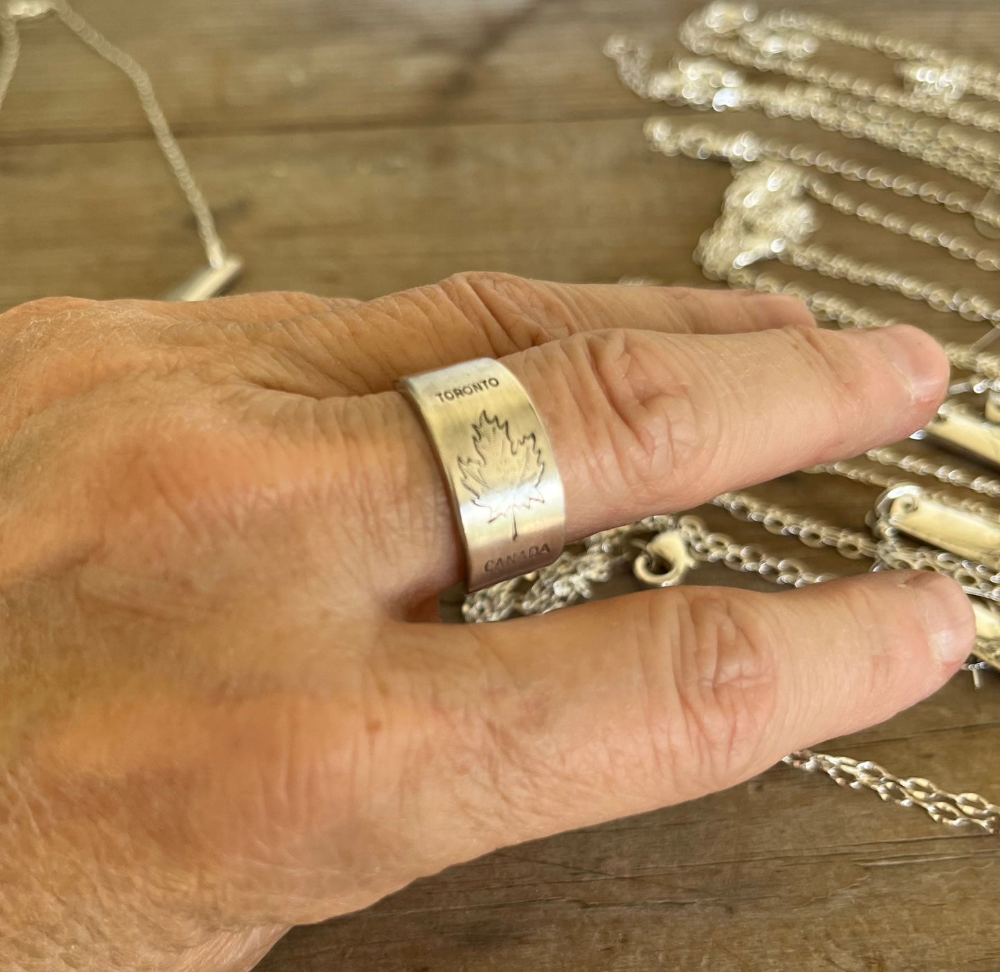 TORONTO CANADA spoon ring worn on finger displaying size and fit of upcycled silverware ring