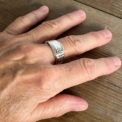 1847 Rogers First Love pattern spoon ring worn on model showing vintage silverware detail - handcrafted from upcycled vintage silverware - Laughing Frog Studio