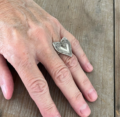 Cotillion heart ring shown on hand - romantic handcrafted upcycled silverware jewelry