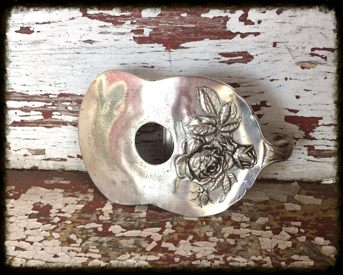 Bridal Rose pattern guitar spoon belt buckle, front view stylized photo - handcrafted from upcycled vintage silverware - Laughing Frog Studio