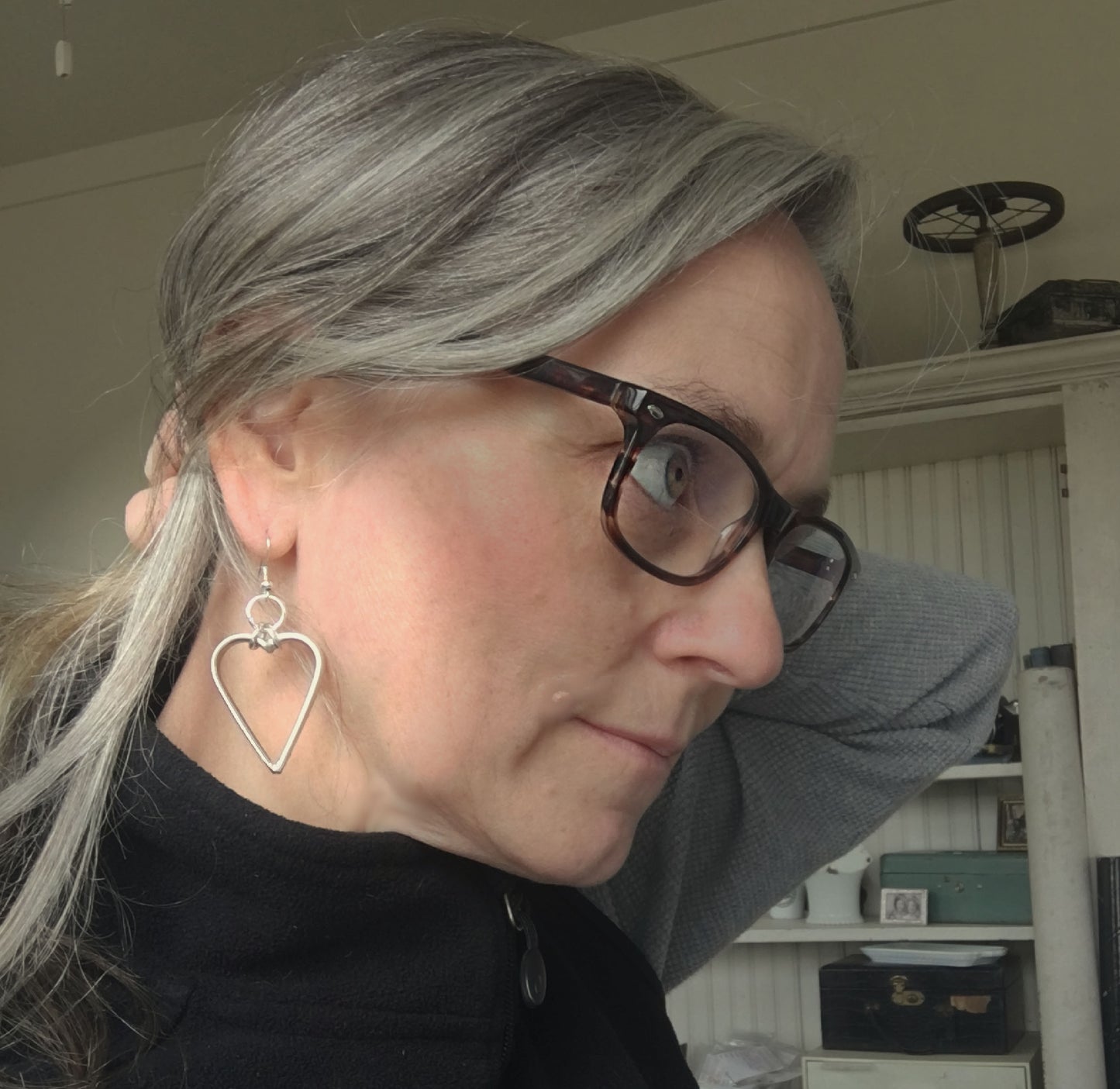 Pierced Dangle hoop earrings made from upcycled silverware shown on model