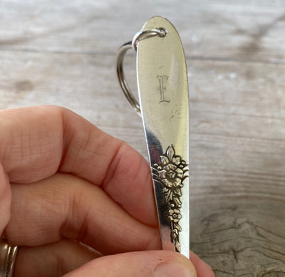 Upcycled vintage silverware spoon handle keychain showing pattern detail and monogram