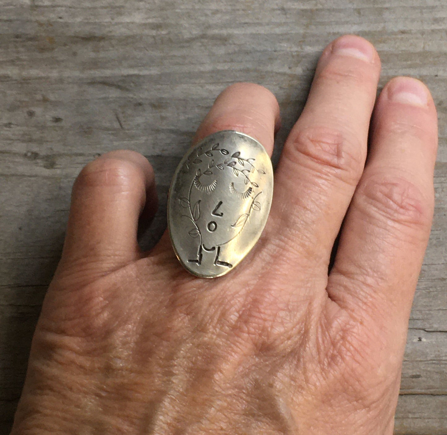 Hand-stamped Kestrel statement ring shown on a hand - nature-inspired vintage silverware jewelry