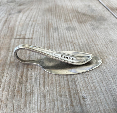 Side view of Spoon Money Clip Handstamped with the word VEGAS