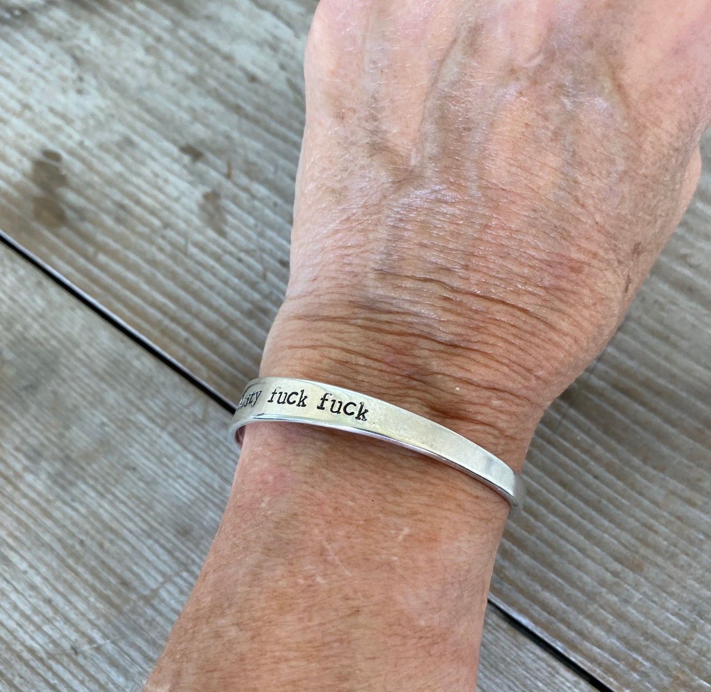 Hand Stamped Upcycled Spoon Cuff Bracelet FUCKITY FUCK FUCk Shown on Human Wrist