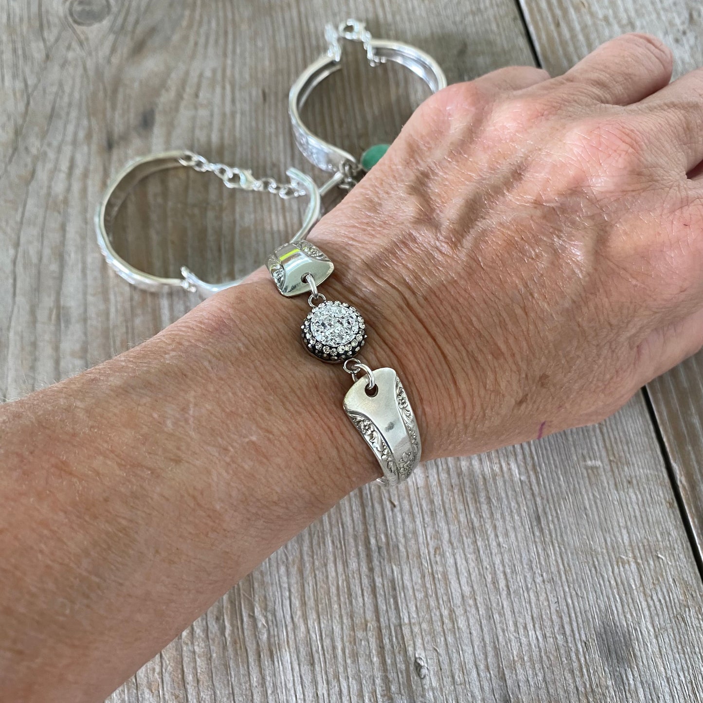 Camelia spoon link bracelet with druzy bead modeled on wrist - handcrafted upcycled vintage silverware