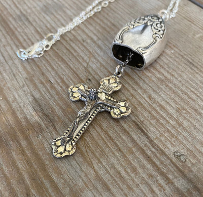 Vintage sterling silver rosary cross hanging as clapper inside upcycled knife bell pendant