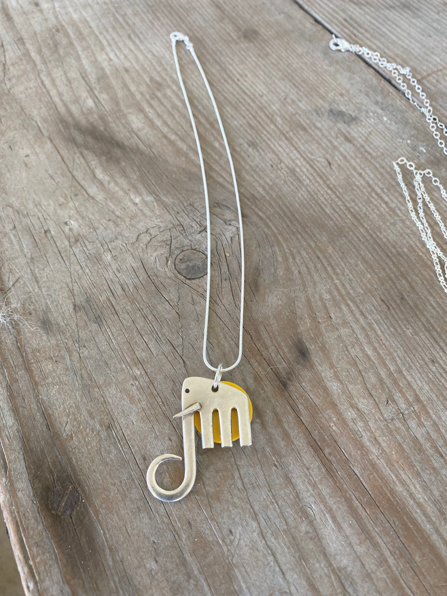 upcycled silverplate fork elephant pendant with yellow disc, 1.5 inches tall