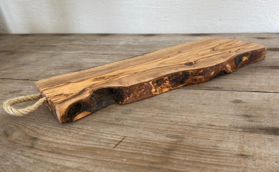Handmade olivewood serving board detail - natural grain and antibacterial Italian wood charcuterie platter