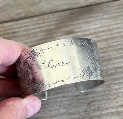 Close-up of CARRIE monogram in script font on sterling silver Victorian ivy cuff bracelet