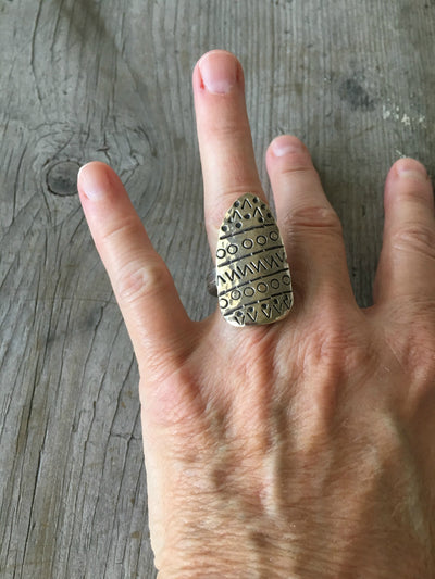 Statement spoon ring with stamped art design shown on hand - handcrafted upcycled silverware jewelry