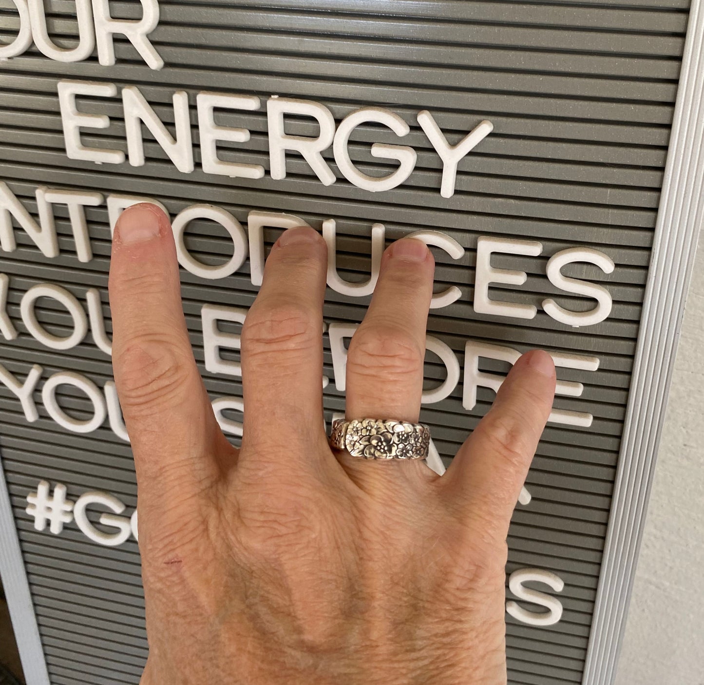 LOVE PRECIOUS FLOWER spoon ring worn on hand showing size and fit of upcycled silverware ring