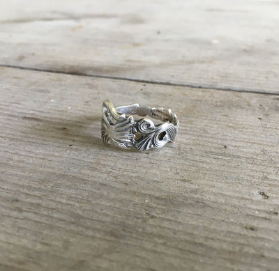 Close-up of SWEDEN pattern spoon ring showing ornate Scandinavian design detail