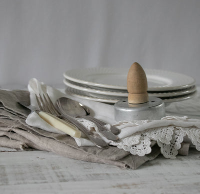 Vintage silverplate flatware and silverware laid out on a table - Laughing Frog Studio
