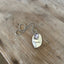 FOREVER spoon necklace showing pewter photo frame detail and hand-stamped lettering on upcycled vintage silverplate