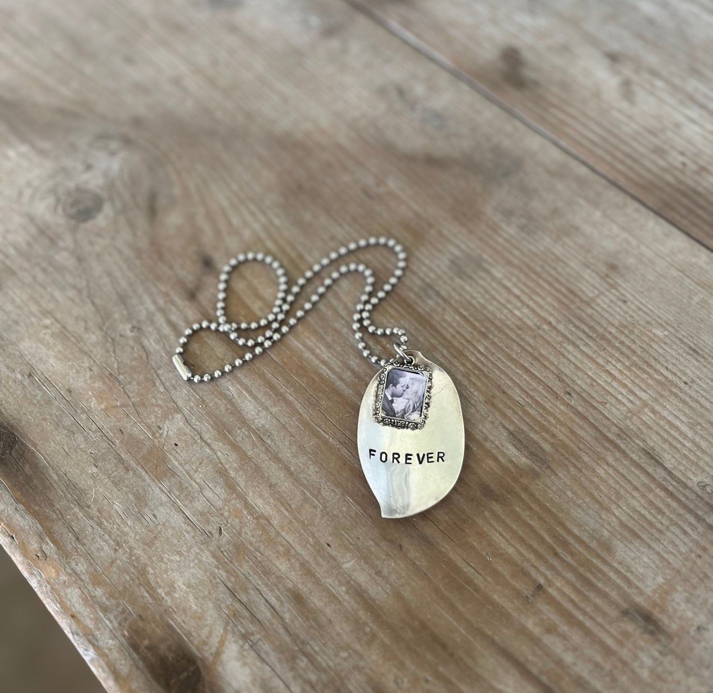 FOREVER spoon necklace showing pewter photo frame detail and hand-stamped lettering on upcycled vintage silverplate