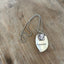 FOREVER stamped spoon necklace with pewter frame modeled showing layerable bohemian style, 17-inch ball chain