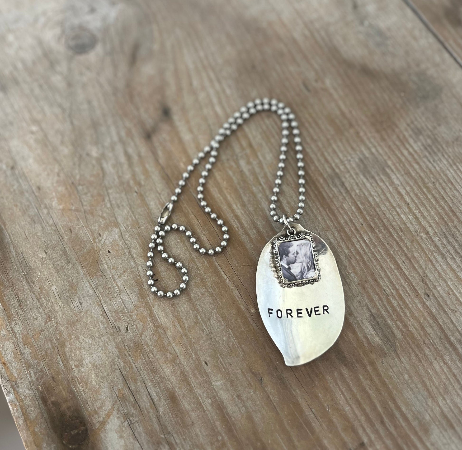 FOREVER stamped spoon necklace with pewter frame modeled showing layerable bohemian style, 17-inch ball chain