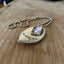 Detail of FOREVER spoon pendant with pewter photo frame showing one-of-a-kind handcrafted design and vintage silverplate patina