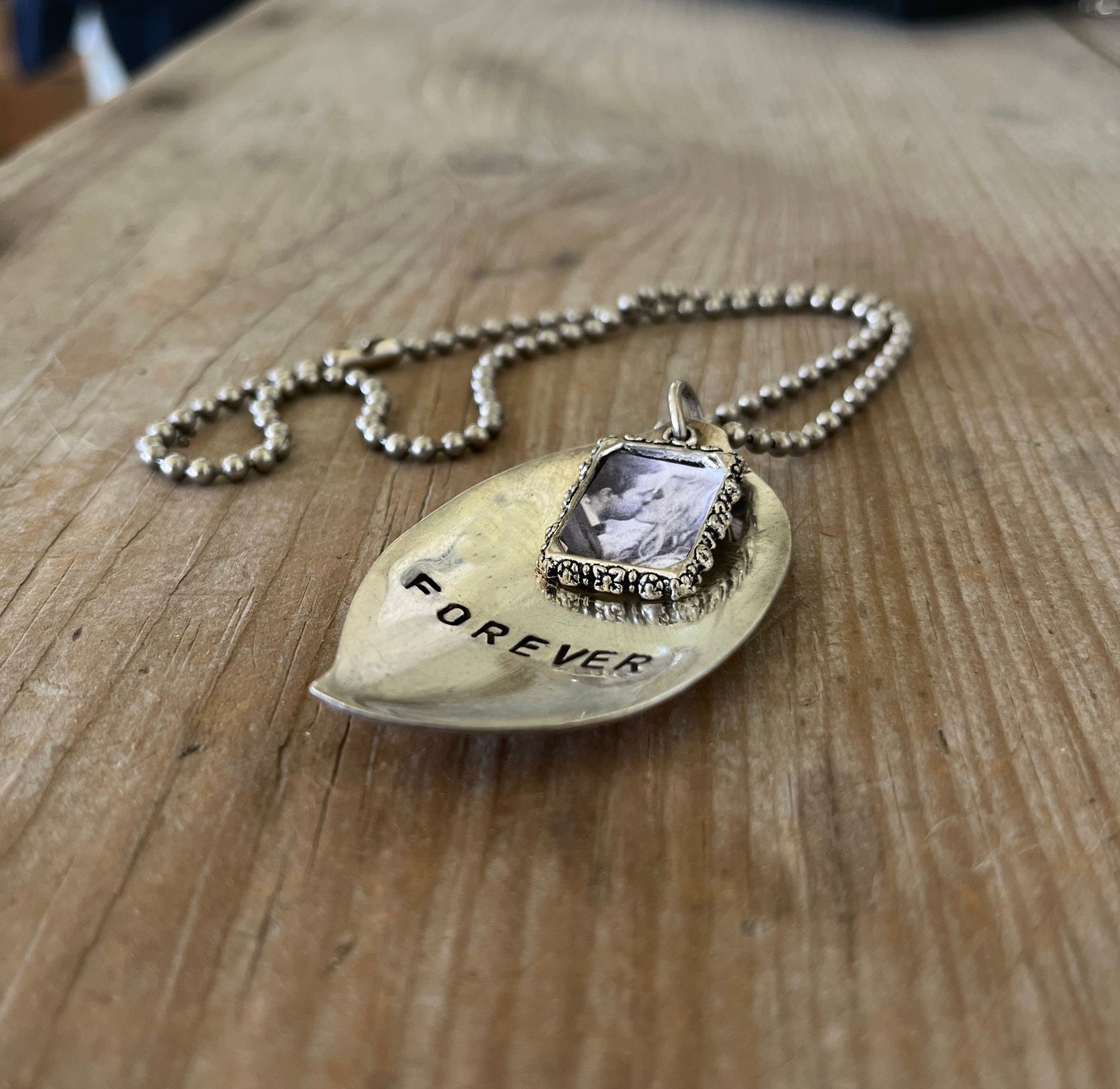 Detail of FOREVER spoon pendant with pewter photo frame showing one-of-a-kind handcrafted design and vintage silverplate patina