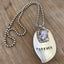Close-up detail of FOREVER hand-stamped spoon pendant with pewter frame for photo, reclaimed vintage silverware, 2.375 inches long