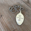 Handcrafted stamped spoon necklace with Robert Kennedy quote 'Tame the Savageness of Man' on upcycled vintage silverplate, meaningful jewelry