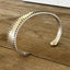 Side view of Vesta silver-plate spoon cuff bracelet showing sculptural silhouette - handcrafted from upcycled vintage silverware - Laughing Frog Studio