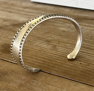 Side view of Vesta silver-plate spoon cuff bracelet showing sculptural silhouette - handcrafted from upcycled vintage silverware - Laughing Frog Studio