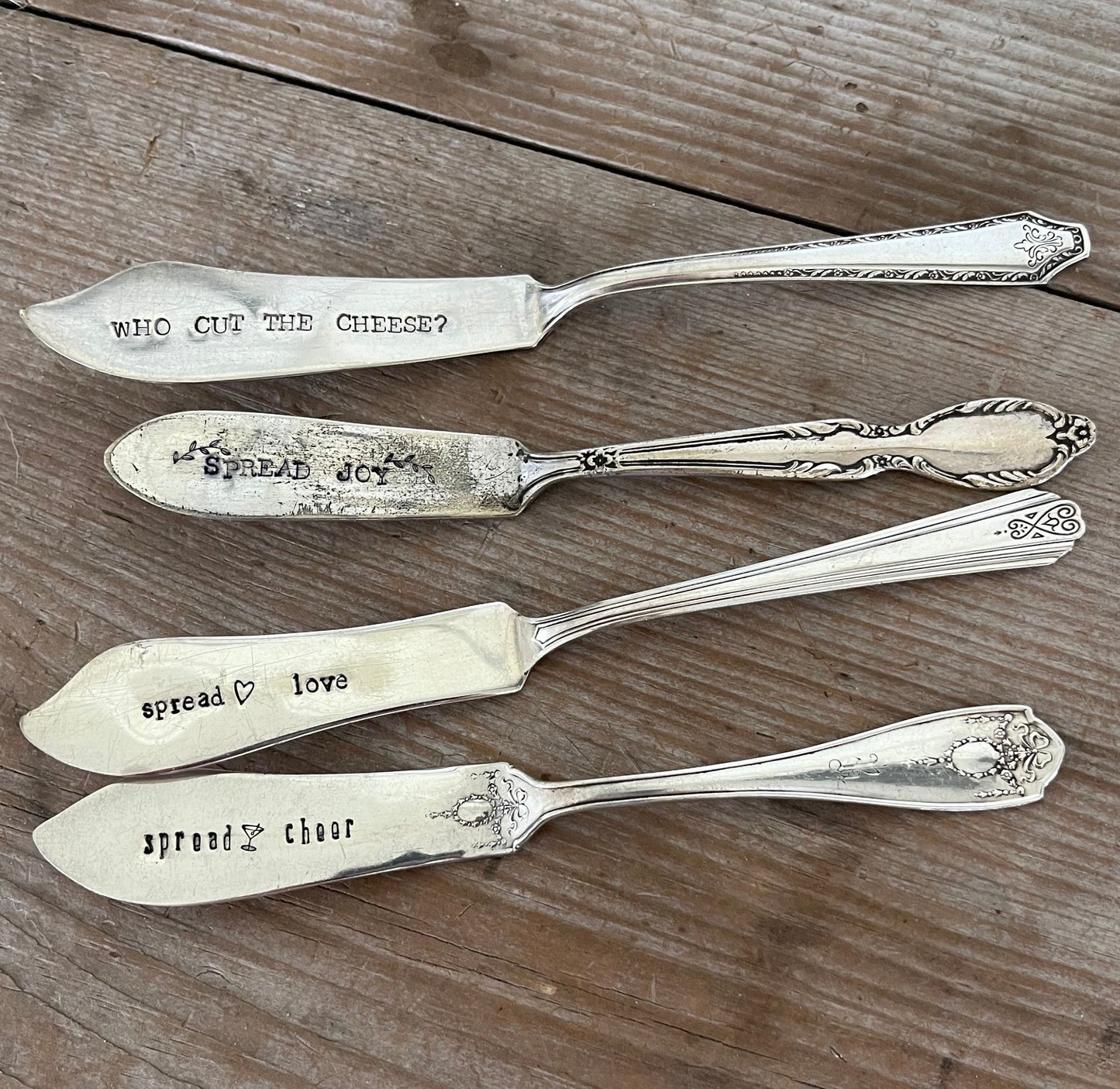 Collection of vintage cheese spreaders with Spread Love stamping - one-of-a-kind upcycled silverware gift