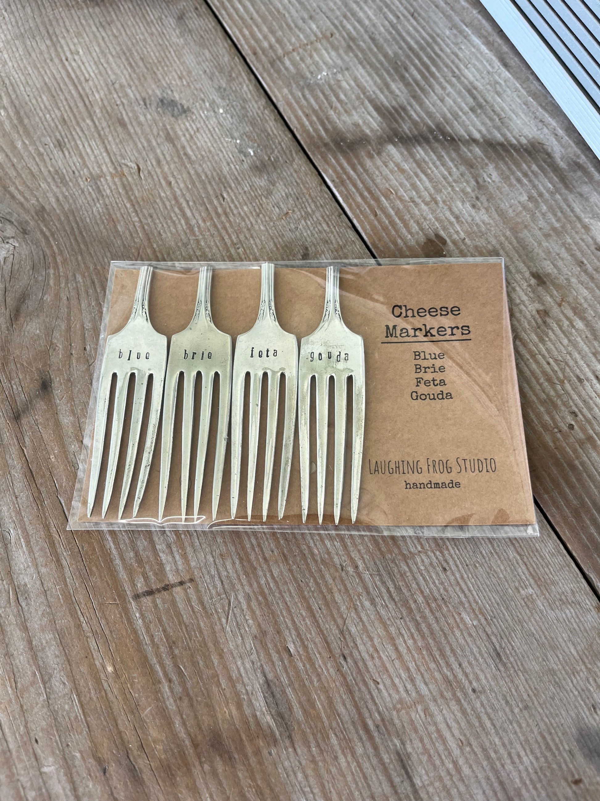 Hand-stamped vintage fork cheese markers detail - contemporary font on upcycled antique silverware for cheese board