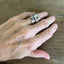 Sterling silver elephant demitasse spoon ring worn on model's hand - handcrafted from upcycled vintage silverware - Laughing Frog Studio